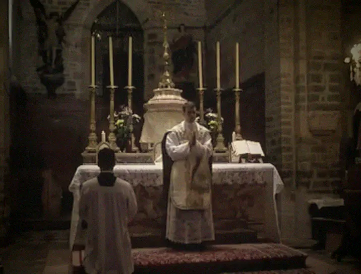 The priest turns to the people at the end of Mass.