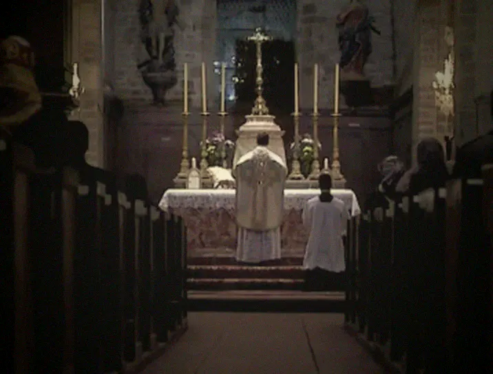The altar seen from the nave, between the pews.