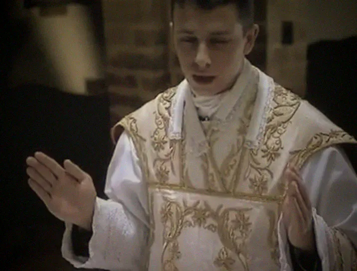 The priest prays the Preface with his hands extended.